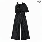 GIRLS BLACK ASYMMETRICAL JUMPSUIT WITH DRAPE DETAIL
